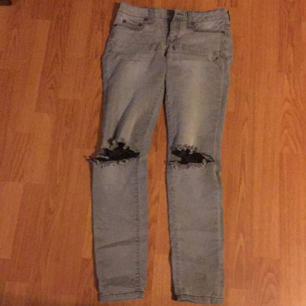 Size 2, light grey jeggins with holes